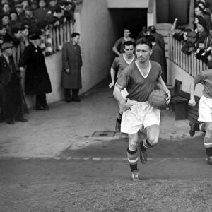 Roger Byrne leads Manchester United out at Old Trafford in 1955
