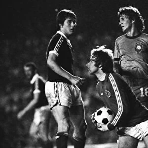 Scotland goalkeeper Alan Rough gather the ball frokm Brazils Zico in 1977