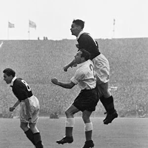 Scotlands Billy Liddell out-jumps Englands Alf Ramsey - 1952 / 3 British Home Championship