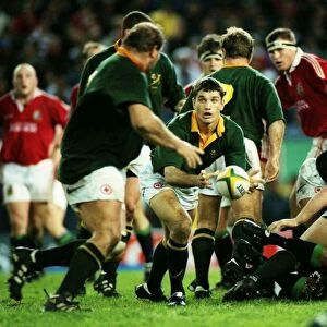 South Africas Joost van der Westhuizen passes the ball out against the British Lions in 1997