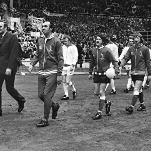 Sunderland manager Bob Stokoe (right) and Leeds United manager Don Revie lead out their teams onto the Wembley pitch for the 1973 FA Cup Final
