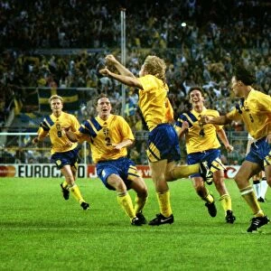 Swedens Tomas Brolin celebrates with his teammates after scoring the winning goal against England at Euro 92