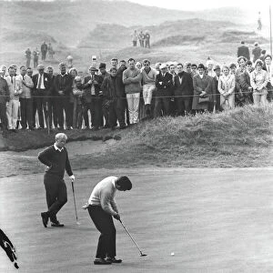 Tony Jacklin putts while Jack Nicklaus looks on during their famous 1969 Ryder Cup singles match