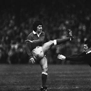 Wales Gareth Davies kicks under pressure from Alan Lawson - 1979 Five Nations