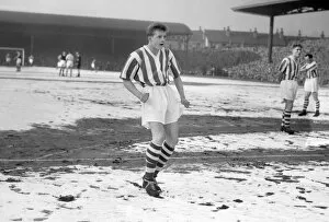 Images Dated 31st March 2010: A 16 year-old Denis Law in the snow for Huddersfield in the FA Cup
