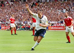 Alan Shearer celebrates scoring the opening goal of Euro 96