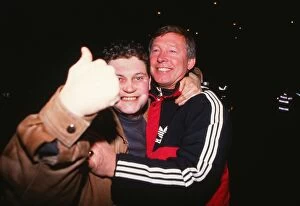 Images Dated 14th February 2012: Alex Ferguson celebrates with a fan after Manchester City reach the 1990 FA Cup Final