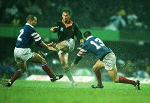 Images Dated 14th December 2009: Andre Joubert kicks ahead in the rain during the 1995 Rugby World Cup semi-final