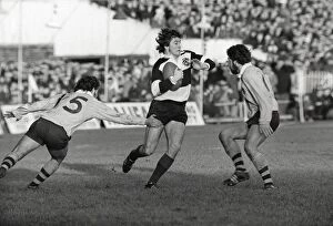 Images Dated 19th February 2009: Andy Irvine evades Australian defenders for the Barbarians in 1976