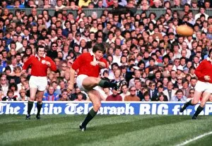 Images Dated 5th September 2012: Andy Irvine kicks for the British Lions against the Barbarians in 1977