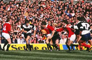 Andy Irvine runs with the ball for the British Lions against the Barbarians in 1977