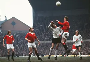 Soccer Prints: Arnie Sidebottom and Bill Dearden jump for the ball at Old Trafford in 1973