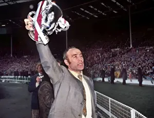 Aston Villa manager Ron Saunders displays the League Cup after victory in 1975