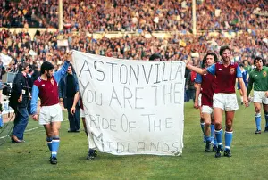Aston Villa players parade a banner at Wembley after the 1977 League Cup Final