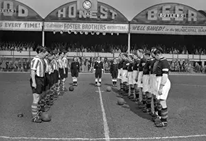 Aston Villa and Stoke City observe a minutes silence at Villa Park for the death of Queen Mary in 1953