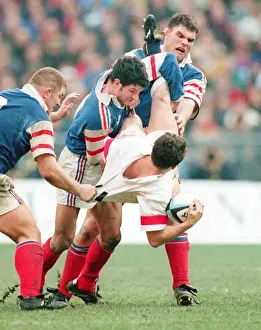 Austin Healey is tackled by Marc Lievremont in the 1998 Six Nations
