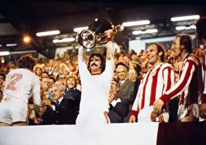 Bayern Munichs Gerd Muller lifts the European Cup in 1974