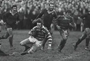 A bloodied JPR Williams in action for Bridgend against the All Blacks in 1978