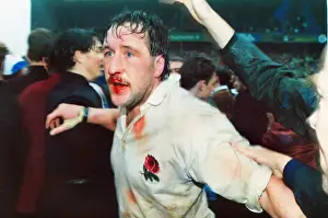 A bloodied Mike Teague celebrates Englands Grand Slam victory - 1991 Five Nations