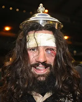 Injury Prints: A bloodied Oxford captain John Carter celebrates victory in the 2011 Varsity Match
