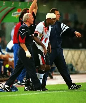 Images Dated 22nd June 2012: A bloodied Paul Ince during Englands famous draw with Italy in Rome in 1998