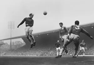 Images Dated 14th February 2012: Bobby Charlton leaps to head the ball in the 1964 / 5 season