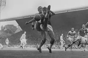 Bobby Moore and Roger Hunt challenge for the ball at Anfield in 1963