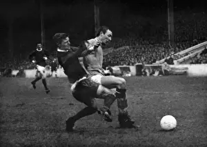 Bobby Noble and Mike Summerbee compete for the ball in the 1966 / 7 Manchester derby at Maine Road