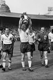 Images Dated 17th January 2011: Bolton captain Nat Lofthouse parades the trophy after victory in the 1958 FA Cup Final