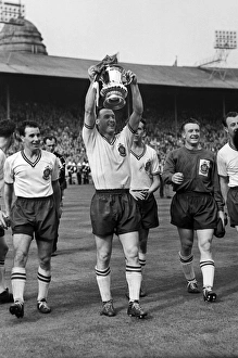 Bolton captain Nat Lofthouse parades the trophy after victory in the 1958 FA Cup Final