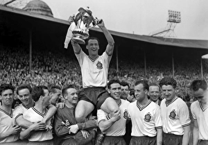 Bolton Wanderers captain Nat Lofthouse is chaired by his teammates after victory in the 1958 FA Cup Final