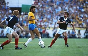 Images Dated 5th December 2011: Brazils Socrates takes on Scotland at the 1982 World Cup