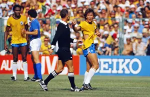 Brazils Zico remonstrates with the referee after his shirt is ripped at the 1982 World Cup