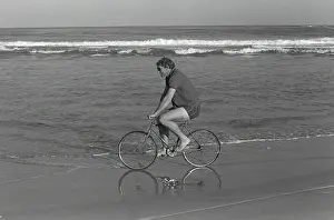 British Lions captain Willie John McBride cycles along the Port Elizabeth beach the day after winning the Test series in South Africa