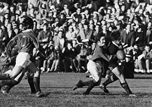 British Lions winger Gerald Davies tackles All Blacks winger Bryan Williams without the ball, resulting in referee John Pring awarded the All Blacks a penalty try during the 2nd Test of the 1971 Tour