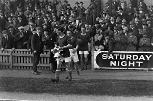 Cardiff City captain Fred Keenor leads his side onto the field with the FA Cup in 1927