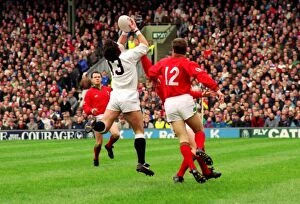 Images Dated 24th January 2013: Will Carling gathers Rob Andrews kick to score against Wales - 1992 Five Nations