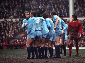 Coventrys Ernie Hunts checks his position in the wall during a game at Anfield in 1971 / 2