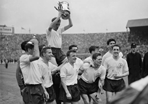 Danny Blanchflower celebrates with his teammates after Tottenham win the FA Cup in 1961