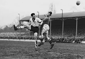 Images Dated 17th January 2012: Darlingtons Ken Furphy and Chelseas Ron Tindall jump for a header during the 1958 FA Cup