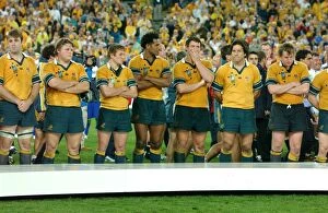 2003 Rugby World Cup Final Collection: Dejected Australian players line up to receive their losers medals