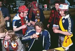 Images Dated 6th April 2010: Denis Law has a drink with Scottish fans at the 1978 World Cup