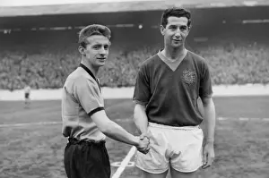Denis Law shakes hands with Leeds Freddie Goodwin on his debut for Manchester City in 1960