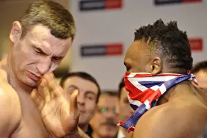 Dereck Chisora slaps Vitali Klitschko at the weigh-in for their world title fight +