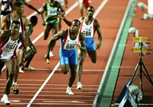 Derek Redmond hands over to John Regis during the 1991 World Championship 4 X 400m relay final