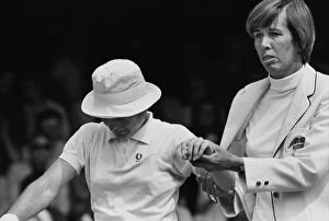 Images Dated 14th June 1970: Doris Hart helps the injured Nancy Richey from the court - 1970 Wightman Cup