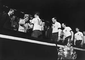 England captain Johnny Haynes receives the Home Internationa Trophy from the Queen after Englands 9-3 win over Scotland in 1961