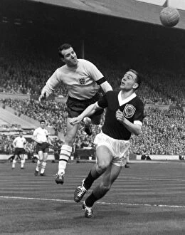 Images Dated 9th August 2013: England goalkeeper Ron Springett punches clear from Ian St. John - 1960 / 1 British Home