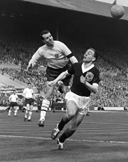 England goalkeeper Ron Springett punches clear from Ian St. John - 1960 / 1 British Home Championship