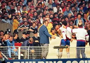 England manager Don Revie comes off the bench to meet Ray Kennedy after his substitution against Scotland- 1977 British Home Championship